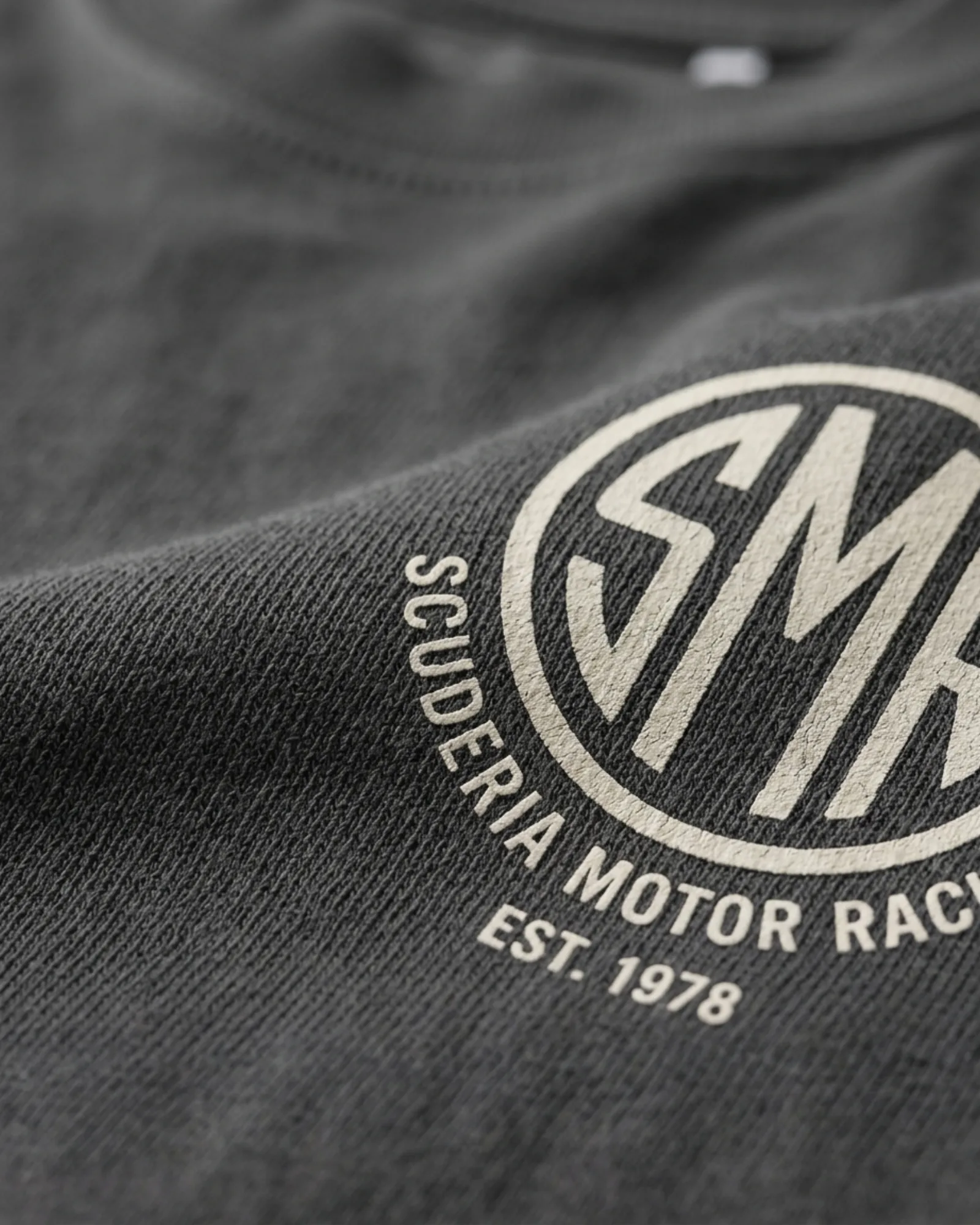 SMR Apex Badge Tee charcoal print detail